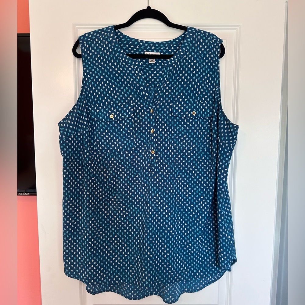 Sleeveless top with gold buttons in green with teal design